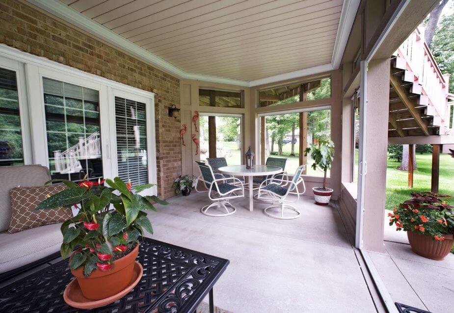 Inviting sunroom with comfortable patio seating and table